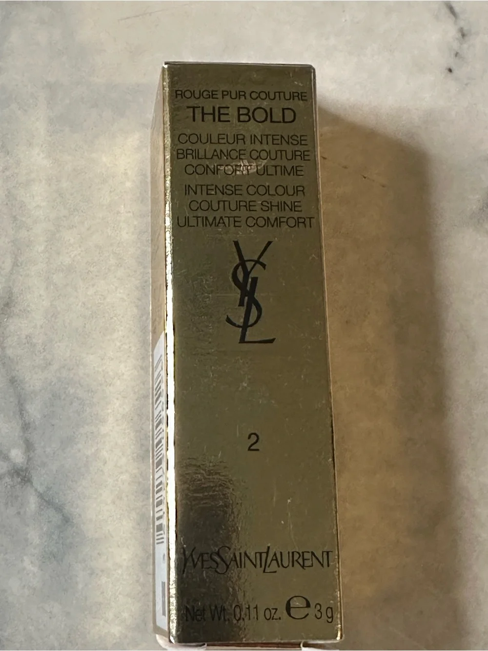 Yves Saint Laurent Gold & Black Tube Lipstick — Bright Red color “Wilful Red.”